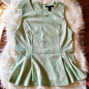 Mint peplum top with white lace detail